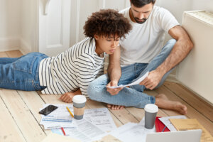 family couple maintains home accounting discuss plans future payments